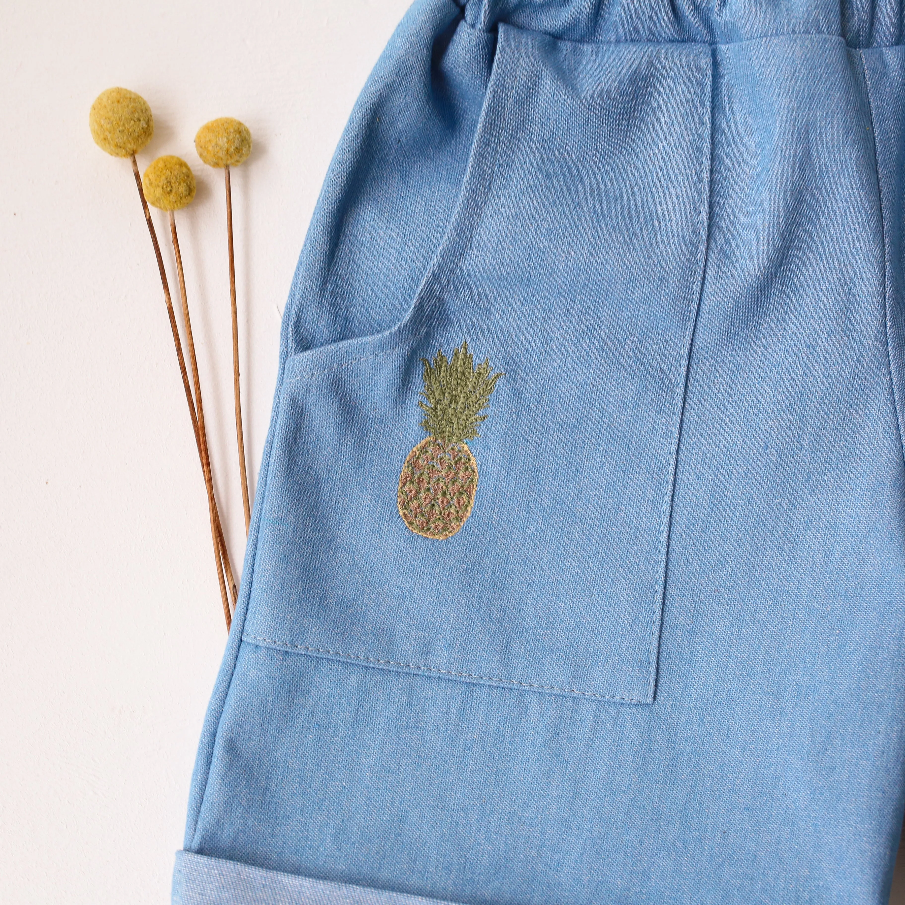 Light Blue Denim Cuffed Shorts with "Pineapple" Embroidery
